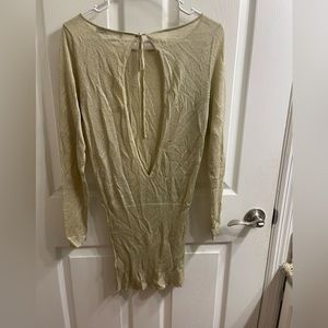 Never worn ,Champagne colored open back shirt